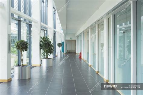 Corridor In Modern Office Building With Glass Walls — Inside Work