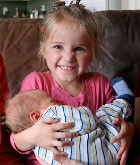 10 Awkward Kids Holding Babies Holding Baby Baby Humour Mom And Baby