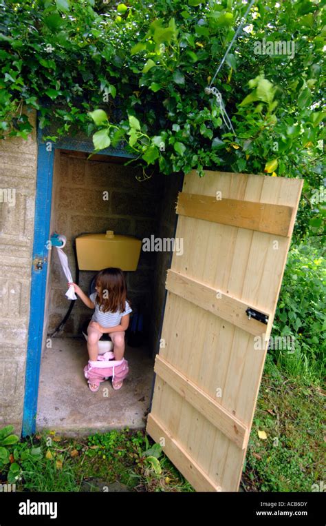 Toilet Outside Toilet Girl Using An Outdoor Toilet Stock Photo