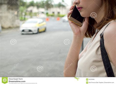 A Woman Is Waiting For A Cab Stock Image Image Of Beautiful Person 94320985