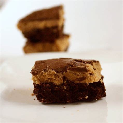 Rich Chocolate Brownies Smothered In Peanut Butter Icing And Chocolate