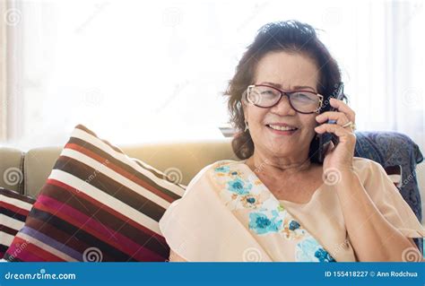old woman is happy for using mobile phone at home stock image image of elderly message 155418227