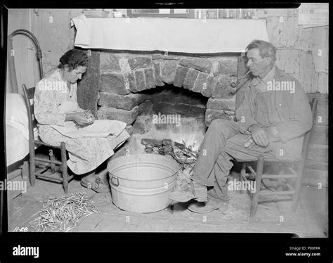 Mr J W Melton And His Wife By The Fireplace Getting Ready For Supper