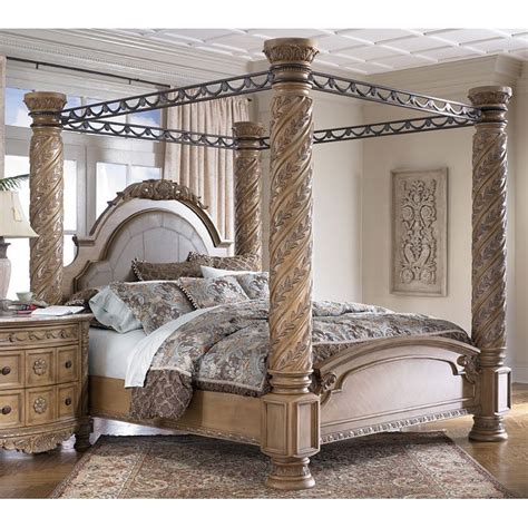 Consider placing a mirror on the wall above a dresser or opt for a vanity and stool set. South Coast Poster Canopy Bedroom Set Signature Design by ...
