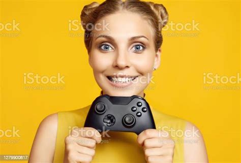 Gorgeous Happy Blonde Gamer Girl Playing Video Games Using Joystick