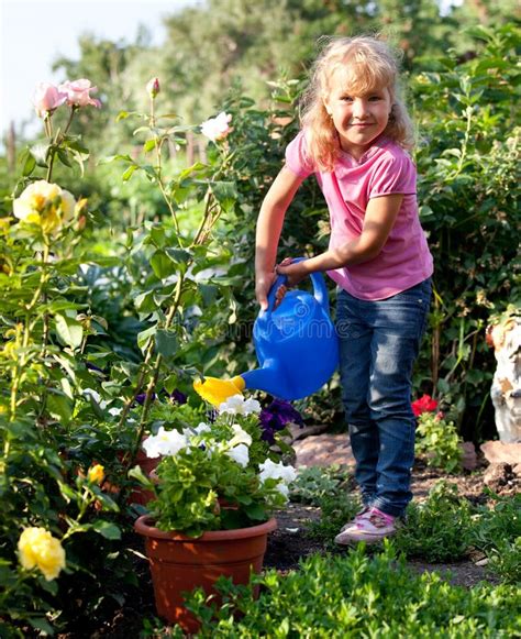 Girl Watering Flowers Are Watered From Stock Photo Image 20455630
