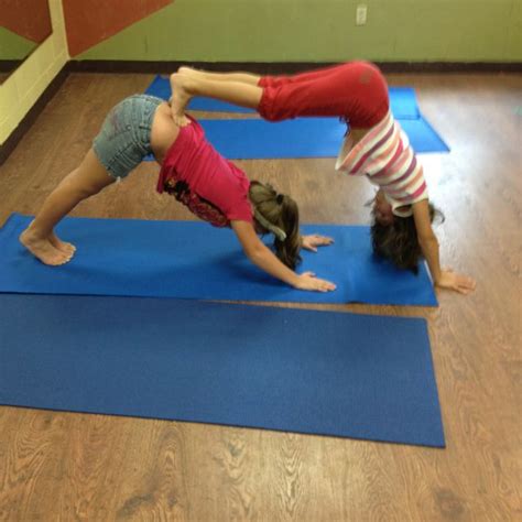 Partner yoga poses for kids! Kids in my yoga class doing "double dog"!! Fun stuff ...
