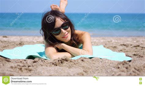 Pretty Woman In Sunglasses Sunbathing On A Beach Stock Photo Image Of