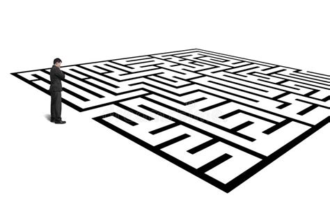 Businessman Standing In Front Of Maze Isolated In White Stock