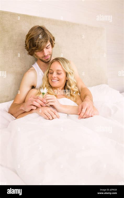 Cute Couple Cuddling In Bed Stock Photo Alamy