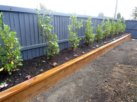 I chose raised garden beds because my garden is on a slope and the soil has plenty of tree roots. Oderings Landscaping | A raised garden bed can be used to ...