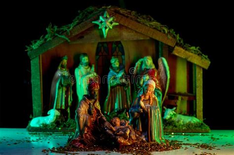 A Christmas Scene With Baby Jesus Mary And Joseph In The Manger