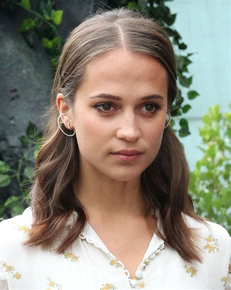 It's another thing to become a tomb raider. Alicia Vikander - Tomb Raider Photocall at the Unique ...