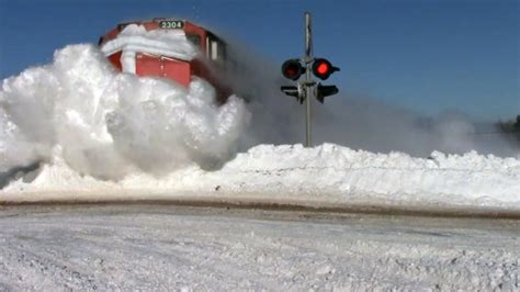 Striking Video Captures Train Plowing Through Deep Snow