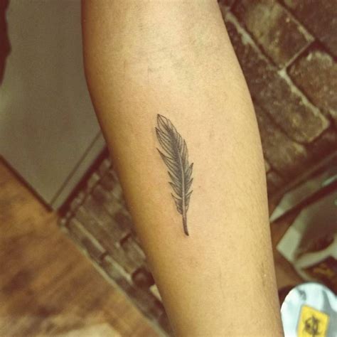 Forearm Tattoo Of A Feather