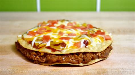 Why You Might See Taco Bells Mexican Pizza On The Menu Again