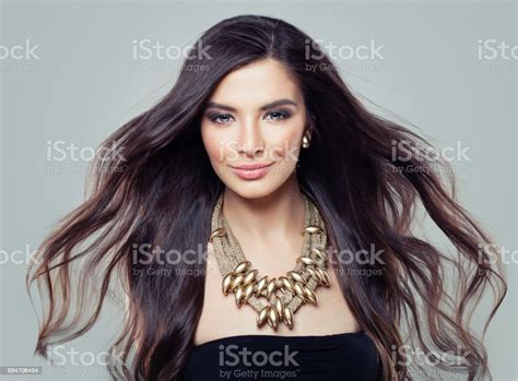 Young Perfect Hispanic Model Woman With Long Blowing Hair And Perfect