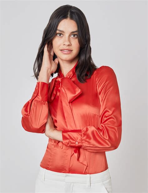 plain satin women s fitted blouse with single cuff and pussy bow in orange hawes and curtis uk