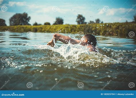 The Young Man Swimming In The River Stock Photo Image Of Nature