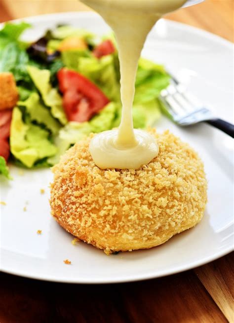 Crescent rolls stuffed with creamy chicken filling, rolled in cheese and breadcrumbs, and topped with creamy. Chicken Pillows with Creamy Parmesan Sauce - Life In The ...