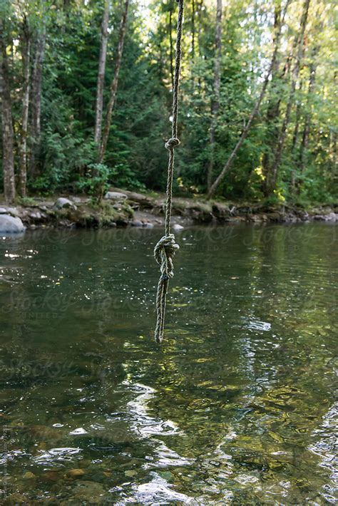 Rope Swing Over River By Stocksy Contributor Ronnie Comeau Stocksy