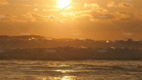 Beautiful Golden Ocean Waves On Sunset Orange Sunrise Reflected At The
