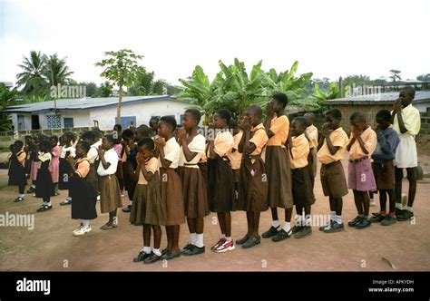 Primary School Children Lined Up For Morning Assembly And Prayers In