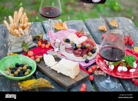 Italian Picnic With Red Wine Parmesan Ham And Olives Lunch In The