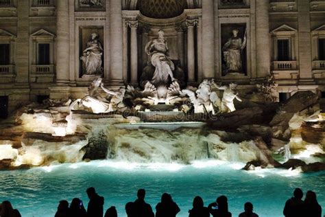 Large Group Of People In Front Of The Fontana Di Trevi In The Night On