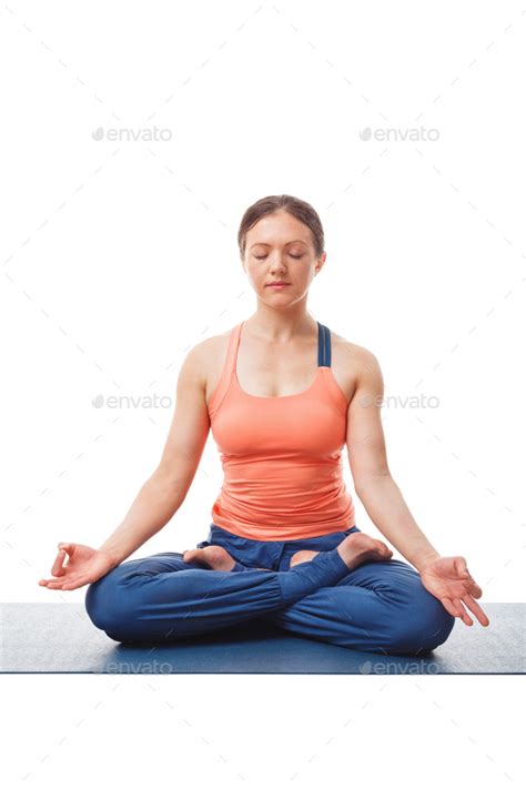 Woman Meditating In Yoga Asana Padmasana Lotus Pose Stock Photo By F9photos
