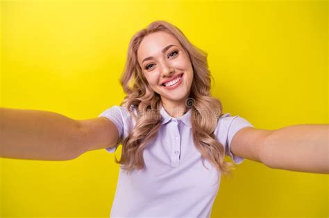 Portrait Of Lovely Cheerful Girl Beaming Smile Make Selfie Recording Video Isolated On Yellow
