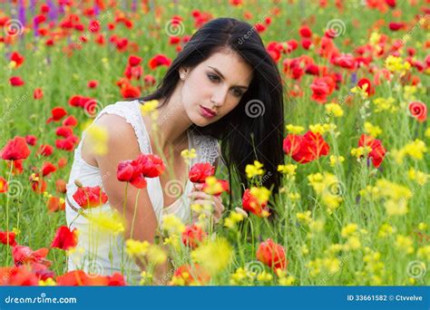 Beautiful Girl Sitting In The Poppy Flower Field Stock Photo Image Of