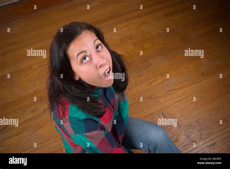 Teen Girl Sitting On The Floor With Her Mouth Open Model Released Stock
