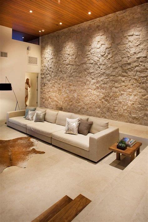 Stone Wall Large White Sofa Small Wooden Side Table Wooden Ceiling