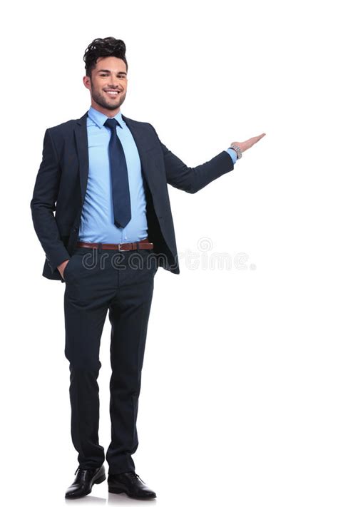 Full Body Picture Of A Happy Business Man Presenting Stock