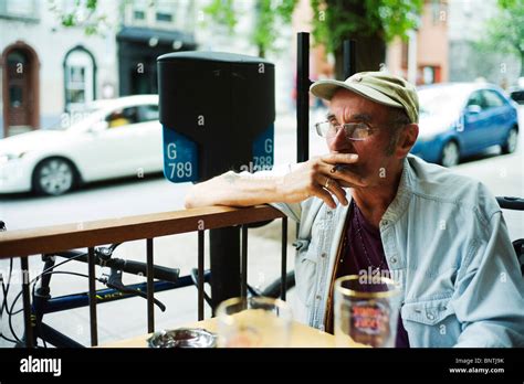 Old Man Smokes Cigarette On Bar Terrace Stock Photo Alamy