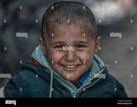 Poor Child Smiles To Life Stock Photo Alamy
