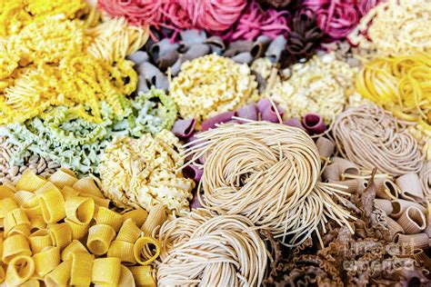Many Types Of Uncooked Italian Pasta Of Various Colors And Shape