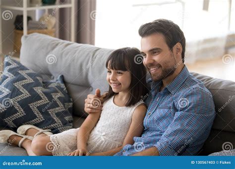 Father Embrace Daughter Sitting Together On Couch Stock Image Image Of Handsome Home 130567403