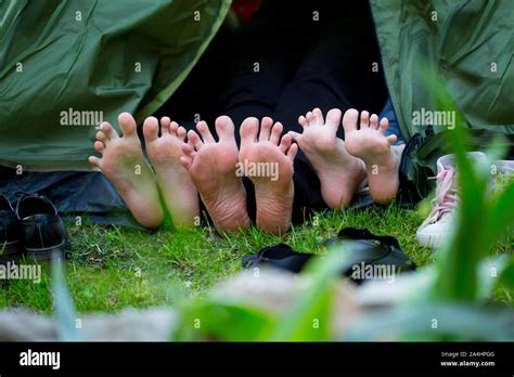 Bare Feet Sticking Out Of A Tourist Tent Stock Photo Alamy