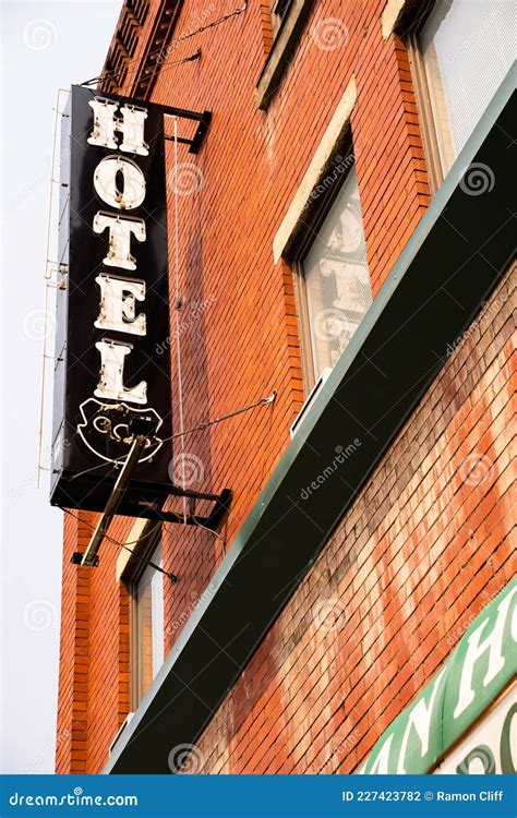 A Vintage Hotel Sign Hanging Vertical Stock Photo Image Of Downtown
