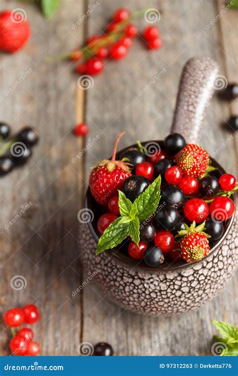 Fresh Berries Various Summer Berries In A Bowl On Rustic Wooden Table