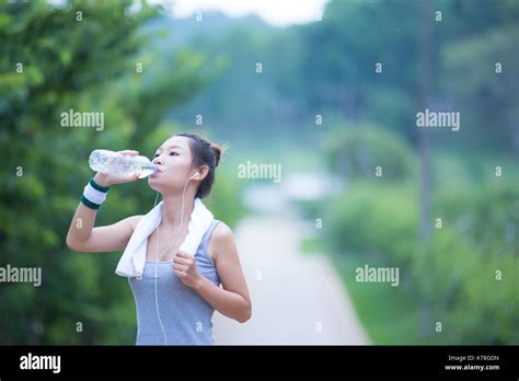 Women Drink Water After Exercising Stock Photo Alamy