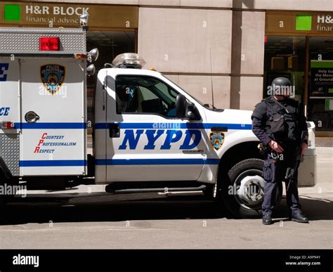 Armed Nypd Police Officer And Vehicle Outside Bank In Financial