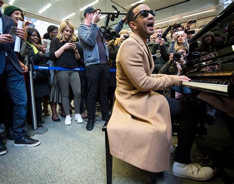 John Legend Surprises Commuters With Performance In London Train Station Us Weekly