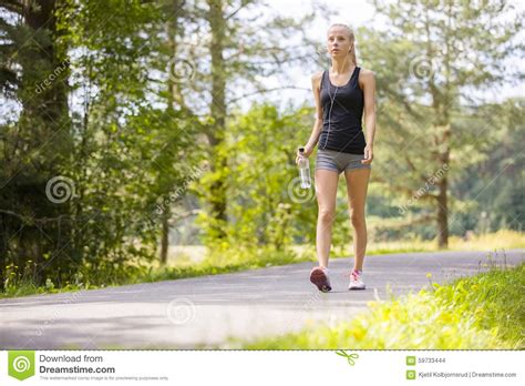 Woman Walking Outdoor In The Forest As Workout Stock Photo