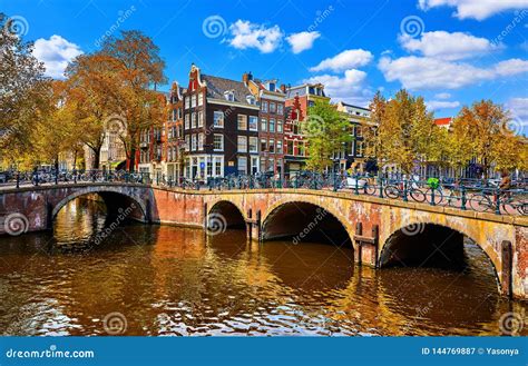 Bridge Over Channel In Amsterdam Netherlands Houses River Amstel Stock