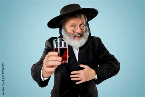 Portrait Of Old Senior Orthodox Hasdim Jewish Man With Kosher Wine At