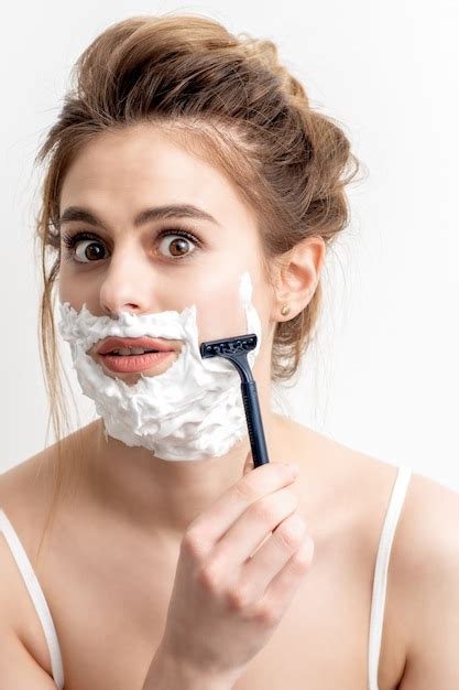 Premium Photo Woman Shaving Her Face By Razor