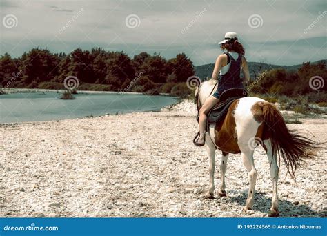 River Landscape Afternoon Girl Woman Lady In A Work Uniform And Hat Is Barefoot Cowgirl